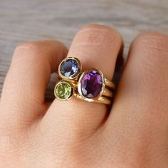 Onegarnetgirl, your designs are awesome!!! Oval Amethyst Birthstone Ring In Yellow Gold, Oval Multi-stone Peridot Gemstones, Oval Peridot Gemstones For Anniversary, Oval Multi-stone Amethyst Gemstones, Gold Oval Multi-stone Stackable Rings, Multi-stone Stackable Rings, Oval Multi-stone Yellow Gold Birthstone Ring, Green Oval Amethyst Ring For Anniversary, Green Amethyst Oval Ring For Anniversary