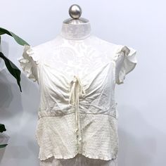 Wild Fable Nwt Cream Flutter Sleeve Crop Top With A Smocked Waist And Front Button Details. Keyhole With Tie Strings In The Front. Summer Smocked Top With Ruffle Hem And Short Sleeves, Casual Smocked Top With Flutter Sleeves, Casual Smocked Top With Ruched Ruffle Sleeves, Summer Flowy Ruched Blouse, Summer Ruched Flowy Blouse, Flowy Smocked Bodice Top With Flutter Sleeves, Flowy Ruched Summer Blouse, Flowy Ruched Blouse For Summer, Casual Flutter Sleeve Rayon Tops