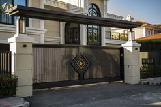 a gated entrance to a large house