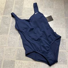 New With Tags Nike One Piece Swimsuit. Features A Scooped U-Back For An Easier On And Off. Liner Still In Place. Blue One-piece Swimwear For Workout, Nike Blue Swimwear For Pool, Nike Blue Swimwear, Blue Lined Sports Bodysuit, Nike One-piece Swimwear For Sports, Nike One-piece Sports Swimwear, Nike Summer Pool Bodysuit, Nike One-piece Swimwear For Pool, Nike Sleeveless Swimwear For Pool