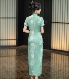 Indulge in the exquisite elegance of this green Cheongsam dress. Featuring a delicate white lisianthus flower print and a traditional mandarin collar, this ankle-length dress is adorned with two subtle side slits, creating a timeless and sophisticated silhouette, perfect for any special occasion. Size Guide: Please refer to the size guide picture before placing the order. Please leave your Height, Weight, Bust, Waist and Hipmeasurements in the Personalisation box so we could double check the siz Green Cheongsam, Lisianthus Flower, White Lisianthus, Qipao Dress, Ankle Length Dress, Cheongsam Dress, Cheongsam, Mandarin Collar, Hanfu