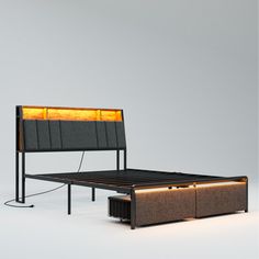 a bed with a light that is on it's headboard and foot board