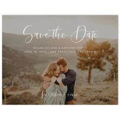 save the date card with an image of two people hugging each other in front of mountains