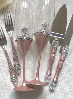 there are five forks, two knives and six spoons in the shape of flowers