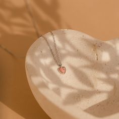 Celebrate the delicate beauty of our Pink Opal Heart Necklace, a charming and minimalistic accessory. Crafted with a heart-shaped pink opal, this dainty necklace not only adds a touch of elegance to your style but also showcases the unique properties of opal, making it a meaningful addition to your collection. Material: High Quality Solid 925 Sterling Silver Finish: Sterling Silver ∙ 18K Gold Featuring a ~5x5mm Pink Opal Heart Charm on an adjustable necklace from 16 to 18 inches Part of our Opal Pink Minimalist Necklace With Delicate Chain, Minimalist Pink Clavicle Chain Necklace, Pink Birthstone Heart Pendant Necklace, Pink Heart Pendant Charm Necklace With Clavicle Chain, Pink Heart Pendant Charm Necklace On Clavicle-length Chain, Pink Heart Pendant Necklace With Birthstone, Pink Heart Pendant Charm Necklace, Delicate Heart Pendant Necklace For Her, Delicate Heart Pendant Necklace As A Gift For Her