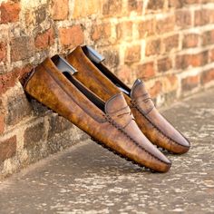 You can also refer to them as "driving loafers" or just "drivers". They are essentially a mocassin-construction slipon with a snug but comfterble fit. The defining feature are the small rubber pebbles that cover the sole and extend to the back of the heel. They are very flexible and provide an added grip. Expertly engineered to keep you two feet comfterble as possible while navigating the road on four wheels, the driving mocassin was the footwear equivalent of the italian auto spirit, marrying l Patina Style, Driving Shoes Men, Dress Shoes Womens, Stylish Shoes, Luxury Shoes