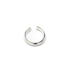 * Sterling silver mini ear cuff, approx. 10mm in diameter, perfect for upper ear. * Handcrafted out of 14 gauge half round wire, approx. 2mm wide, 1mm thick. * Adjustable which means one size fits all. No piercing required. * Our jewelry is packaged in a cute pillow box or envelope. You can also request a personal message which we hand write onto a gift tag. We try to package responsibly in an effort not to waste. Often more than one item will be placed in the same box. Please specify if you wou Adjustable Silver Hoop Ear Cuff, Adjustable Minimalist Hoop Ear Cuff, Adjustable Round Ear Cuff For Everyday Wear, Adjustable Open Ring Ear Cuff, Adjustable Open Ring Ear Cuff For Everyday, Adjustable Hypoallergenic Minimalist Ear Cuff, Adjustable Open Ring Cartilage Earrings In Minimalist Style, Adjustable Open Ring Minimalist Cartilage Earrings, Adjustable Minimalist Open Ring Cartilage Earrings