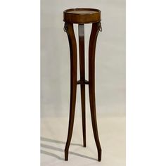 a wooden table with a glass top and two legs on the bottom one leg is bent