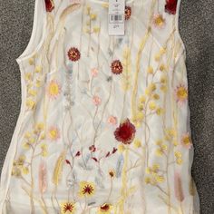 Nwt Suzy Shier Embroidered Knit Tank Top Size Small-Never Worn. 100% Polyester With Embroidered Mesh Front Detail And Solid Back. White Fitted Top With Machine Embroidery, Fitted White Top With Machine Embroidery, Fitted White Tops With Machine Embroidery, White Crew Neck Top With Floral Applique, White Tops With Machine Embroidery For Spring, White Machine Embroidered Tops For Spring, White Sleeveless Top With Floral Embroidery, White Sleeveless Embroidered Top, White Floral Embroidered Sleeveless Top