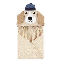 a dog in a towel with a hat on it