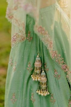 Shop for Anupraas by Nishant and Rahul Green Cutdana Embroidered Lehenga Set for Women Online at Aza Fashions Green Lehenga With Cutdana And Kundan, Green Lehenga With Cutdana For Reception, Green Kundan Sets For Reception, Green Lehenga With Resham Embroidery For Transitional Season, Transitional Green Lehenga With Resham Embroidery, Pista Green Kundan Sets With Traditional Drape, Green Chandbali Lehenga For Diwali, Green Palazzo Set With Dupatta For Reception, Transitional Anarkali Green Lehenga