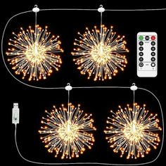 three fireworks are lit up in the dark with remote controls on either side and below them