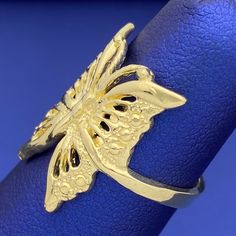 This butterfly ring is a bold statement of beauty and luxury. Crafted with solid 10k yellow gold, this elegant masterpiece will make you feel like royalty. Its intricate details make it a timeless accessory that will be cherished for a lifetime. Grab this stunning piece now and make your presence felt! Metal: 10k GoldType: RingSize: 6.5 West Indian Bangles, Picture Pendant, Bangles Indian, Butterfly Ring, Name Jewelry, Timeless Accessories, Kids Jewelry, Pendant Earrings, Chain Pendants