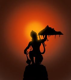 the silhouette of a man holding a dragon on top of a hill