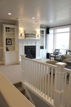 a living room filled with furniture and a fire place