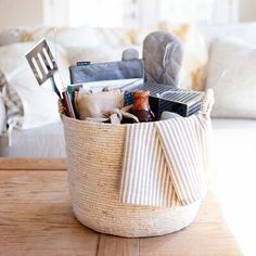 a basket filled with items sitting on top of a wooden table