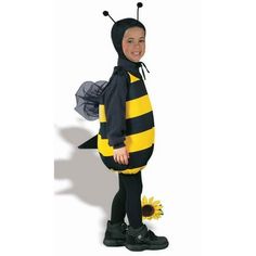 a child wearing a bee costume standing in front of a white background with sunflowers