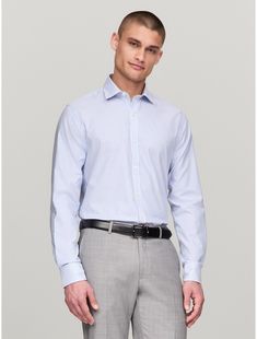 Tommy Hilfiger men's shirt. For work and weekends, our long-sleeve shirt is made from cotton twill blended with THFlex stretch fibers for extra stretch and structure, and cut in a flattering, slim fit.  Material: 96% Cotton - Conventional, 4% Elastane - Conventional. Professional Cotton Slim Fit Shirt, Professional Slim Fit Cotton Shirt, Tommy Hilfiger Fitted Long Sleeve Shirt, Modern Long Sleeve Shirt For Office, Modern Long Sleeve Dress Shirt For Office, Slim Fit Professional Shirt For Business Casual, Slim Fit Long Sleeve Dress Shirt For Office, Smart Cotton Dress Shirt For Business Casual, Smart Cotton Dress Shirt For Business