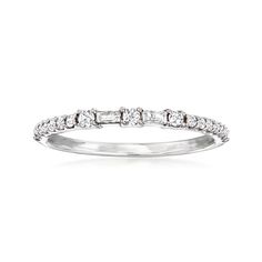 a white gold wedding ring with diamonds on the sides and four stones in the middle