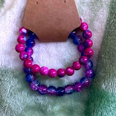 Pink And Purple Beaded Bracelet Set (Two Included) Handmade Purple Stretch Bracelet, Trendy Purple Jewelry With Spacer Beads, Casual Purple Bracelets With Colorful Beads, Casual Purple Beaded Bracelet With Colorful Beads, Purple 8mm Beads Bracelet, Trendy Purple Beads For Gifts, Purple 8mm Bead Bracelet, Adjustable Purple Faceted Beads, Trendy Hand-strung Purple Bracelets