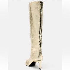 High-Heel Boots With A Metallic Effect. Pointed Toe. Heel Height: 6.5 Cm. / 2.5″ Chic Gold Boots With Sculpted Heel, Gold Knee-high Evening Boots, Elegant Gold Knee-high Boots For Party, Elegant Gold Knee-high Boots For Formal Occasions, Chic Gold High Heel Knee-high Boots, Elegant Pointed Toe Gold Knee-high Boots, Chic Gold Knee-high Boots For Evening, Elegant Gold High Heel Knee-high Boots, Elegant Gold Knee-high Boots With Pointed Toe