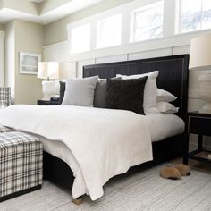 a bedroom with a large bed and two nightstands