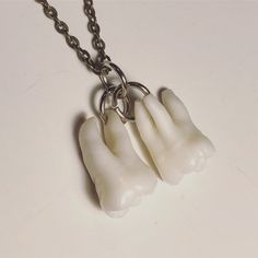 "YOU MUST SEND ME A TOOTH FOR THIS LISTING (OR TWO TEETH). If you have 3 or 4 teeth you must buy this other listing instead: https://www.etsy.com/listing/568883946/your-supplied-teeth-real-human-molar This listing is for ONE necklace like pictured here WITH YOUR SUPPLIED TOOTH/TEETH. PLEASE READ THE ENTIRE LISTING. Will include one 24\" necklace (last photo show chain examples - top is gunmetal, middle in antique silver, bottom is antique brass.) How many roots your tooth has will depend on how Wisdom Teeth Necklace, Tooth Jewellery, Bat Ears, Molar Tooth, Teeth Jewelry, Tooth Necklace, Must Buy, Funky Jewelry, 1 Or 2