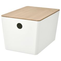 a white storage box with a wooden lid and black circle on the front, isolated against a white background