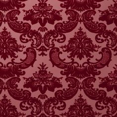 a red wallpaper with an ornate design on it