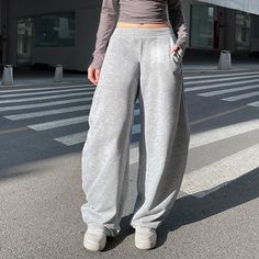 Gray Mid-rise Sweatpants - Cherryourshop Athleisure Pants With Loosely Fitted Hips For Elevated Casual, Solid Color High-waisted Pants For Streetwear, Full Length Athleisure Pants With Hip Pockets, Sporty Solid Pants For Elevated Casual Occasions, Sporty Solid Pants For Elevated Casual, Gray High Waist Pants With Hip Pockets, High Waist Gray Pants With Hip Pockets, Gray Baggy High-waisted Pants, Wide Leg Bottoms With Hip Pockets For Winter