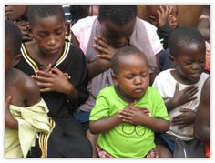 a group of young children sitting next to each other