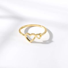 Discover Timeless Elegance and Romance Embrace the essence of love and sophistication with our Heart-Shaped Love Ring, crafted to perfection for the modern woman. Combining the durability of stainless steel with the warm tones of copper, this ring captures the heart of bohemian and romantic styles. Whether you're walking down the aisle or stepping out for a night on the town, this piece is designed to make a statement of love and fashion. Product Features Material Excellence: Crafted from high-quality stainless steel and copper, offering durability and a timeless appeal. Elegant Design: Features a captivating heart-shaped pattern, set in a tension mount for a sleek and secure fit. Versatile Style: Merges bohemian charm with trendy elegance, suitable for weddings, parties, and every day. Co Heart Cut Jewelry For Wedding And Mother's Day, Adjustable Heart Ring For Mother's Day, Yellow Gold Jewelry For Valentine's Day Wedding, Yellow Gold Jewelry For Wedding On Valentine's Day, Adjustable Heart-shaped Couple Rings For Valentine's Day, Adjustable Heart Cut Rings For Mother's Day, Rose Gold Heart-shaped Wedding Ring, Double Heart Ring For Valentine's Day, Minimalist Adjustable Heart Ring For Wedding