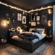 a bedroom with black walls and lights on the ceiling, an area rug is in front of the bed