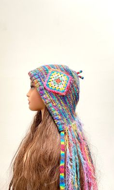 Crazy Knit Hat Bohemian Hat Hippie Knit Hat Funky Hat Fringe Knit Hat.  One of a kind winter hat.  This hat will fit all head sizes. It is our promise that you will not find this hat anywhere else.  Make a Bold Statement with this crazy knit hat handcrafted with lots of craziness and love.  Hand knitted with rainbow mixed color acrylic yarn and embellished with a beautiful granny square crochet applique. Care instruction: Hand wash or machine wash in gentle cycle.  Air dry only. Fast shipping. Your order will be shipped within 24 hours. Thanks. Adjustable Knit Cap, Adjustable Knit Beanie, Adjustable Knit Beanie Hat, Adjustable Knit Crochet Winter Hat, Adjustable Knit Crochet Hat For Winter, Adjustable Knit Bonnet Cap, Adjustable Knit Cap Bonnet, Adjustable Knit Bonnet, Bohemian Beanie Crochet Hat