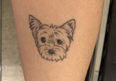 a small dog's face is shown on the leg and it appears to be in black ink