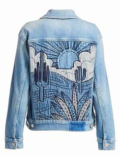 a women's jean jacket with cactus designs on the back