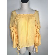 Zac & Rachel Peasant Tunic Top Size: Medium Color: Yellow (Tag Color: Flax) Condition: Nwt, New Features: Square Neck With Stretch, Cinched Sleeve, Tie Sleeve, Sheer, Flowy, Boho, Peasant Material: 65% Rayon 35% Polyester Measurements Are Shown Inside Photos Smoke Free Home I Ship Same Or Next Day, With The Exclusion Of Holidays With No Mail Delivery Spring Flowy Tops With Smocked Back, Summer Flowy Ruched Blouse, Summer Ruched Flowy Blouse, Flowy Ruched Blouse For Summer, Flowy Ruched Summer Blouse, Summer Cotton Blouse With Smocked Bodice, Flowy Smocked Top For Spring, Spring Vacation Tops With Smocked Back, Spring Cotton Smocked Top With Relaxed Fit