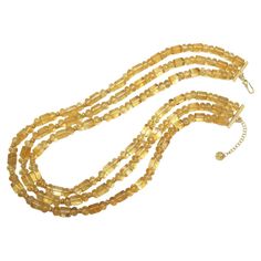 This necklace is so pretty and unusual - and the neutral color goes with everything! It features 3 strands of highly transparent, golden citrine beads of various sizes and shapes, hand-strung with 14k and 18k yellow gold rondelle spacers for extra sparkle. Make this flattering golden necklace your signature piece! Necklaces measure 18.5, 19.5 and 20.5 inches in length Gold Faceted Multi-strand Jewelry, Elegant Amber Crystal Necklaces With Polished Beads, Elegant Faceted Amber Crystal Necklaces, Elegant Faceted Amber Crystal Necklace, Elegant Amber Faceted Crystal Necklace, Elegant Multi-strand Amber Necklace, Elegant Amber Necklace With Gold Beads, Elegant Amber Citrine Crystal Necklaces, Elegant Amber Citrine Crystal Necklace