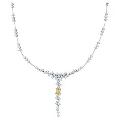 This beautiful and unique necklace features 5.30 carat total weight in white diamonds that drop with a 2.00 carat light fancy yellow radiant diamond at the center set in 18 karat yellow gold. The diamonds seem to float and are set in 18 karat white gold. This necklace features an adjustable box clasp closure with safety clasp. Measurements: The drop is approximately 2" White Diamond Necklace, The Bling Ring, Diamonds Necklace, Diamond Jewelry Designs, Radiant Diamond, Box Clasp, Unique Necklace, Bling Rings, Diamond Jewellery