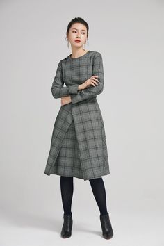 "Retro wool plaid long sleeves dress in classic hues of gray, black and white. This dress features a round neckline,fitted waist, fully lined and a back zipper closure. Details: * plaid wool fabric with fully polyester lining * long sleeves * round neckline * back zipper closure * no pockets * knee length * with buttons decoration * womens dresses, winter dress SIZE GUIDE Size vary between Brand and Country Please get your body measurement with our Size Guide And Find your size in our Size Chart Wool Long Sleeve Dresses For Work, Plaid Midi Dress For Work, Winter Wool Tweed Dress Knee-length, Winter Wool Tweed Knee-length Dress, Knee-length Wool Tweed Dress For Winter, Plaid Long Sleeve Midi Dress For Work, Office Wool Dresses With Long Sleeves, Long Sleeve Wool Dresses For Office, Fall Tweed A-line Dress For Work