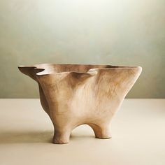 two wooden bowls sitting on top of a table