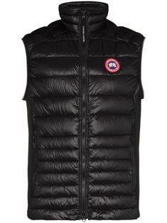 Black Hybridge Lite padded gilet from CANADA GOOSE featuring logo patch to the front, high neck, front zip fastening, sleeveless and two side zip-fastening pockets. | Canada Goose Hybridge Lite padded gilet Hooded Gilet, Outdoor Jackets, Mens Outdoor Jackets, Padded Gilet, Navy Quilt, Dark Autumn, Autumn Night, Chicken Coops, Outerwear Vest