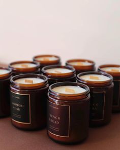 many candles are lined up on a table