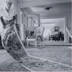 an older woman vacuuming the carpet in her living room