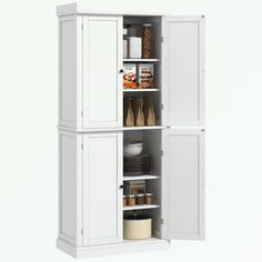 a tall white cabinet filled with lots of food