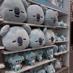 there are many blue teddy bears on the shelves in this store, and they look like they're ready to be sold