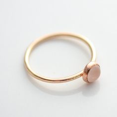 14k Yellow Gold Filled Ring with 5mm genuine rose quartz. Stackable ring. Also available in sterling silver and rose gold filled. This ring is made to order in your size. If you don't see your size available please feel free to message me. All orders ship in a gift box. If you are ordering multiple items and want them boxed separately, please let me know in the notes at checkout. I ship via USPS. Please review the estimated delivery date and processing times. Processing times vary based on how b Minimalist Rose Gold Oval Jewelry, Rose Gold Sterling Silver Midi Rings, Simple Tiny Rose Gold Midi Rings, Delicate Stackable Rose Gold Sterling Silver Rings, Rose Gold Gemstone Stackable Promise Rings, Simple Adjustable Rose Gold Rings, Delicate Rose Gold Stackable Rings With Round Band, Simple Rose Gold Stackable Round Band Rings, Dainty Rose Gold Round Band Ring