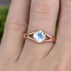 "This is a 1 carat natural moonstone engagement ring in solid gold,about 7mm round cut. It can be made in any ring size. However please contact me to custom make it to a special big or small size. It can be made in white gold,rose gold or yellow gold with 14k or 18k. However for some people who are nickel allergic,I can also make it to 925 sterling silver to make you can wear it. The ring is handmade,very high quality! 30 days money back guarantee. Returns & Warranty 30-Day money back guaran Delicate Moonstone Ring With Rose Cut Diamonds, Elegant Moonstone Ring With Prong Setting, Gift Solitaire Moonstone Ring With Round Cut, Solitaire Round Cut Moonstone Ring Gift, 14k Gold Solitaire Moonstone Ring For Promise, Round Cut Solitaire Moonstone Ring Gift, 14k Gold Moonstone Ring With Prong Setting, Dainty Solitaire Moonstone Ring With Round Band, Dainty Moonstone Solitaire Ring With Round Band