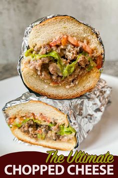 an image of a sandwich with meat and lettuce in foil on a plate