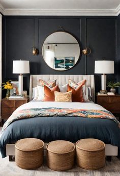 a bedroom with black walls, white bedding and wooden stools in front of the bed